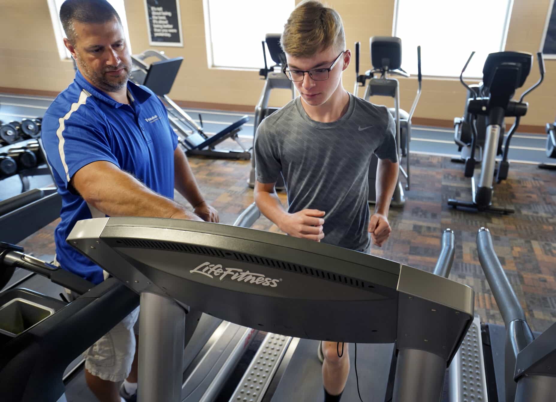 Photo of man exercising on treadmill